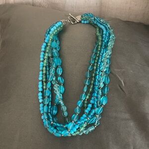 Multi strand choker necklace in greens and blues
